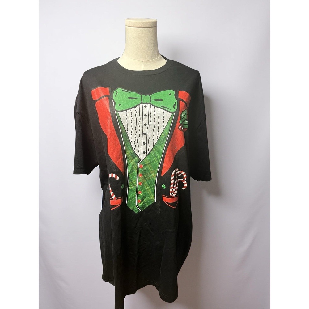 Fun holiday novelty tee featuring a printed tuxedo design with green bow tie.
